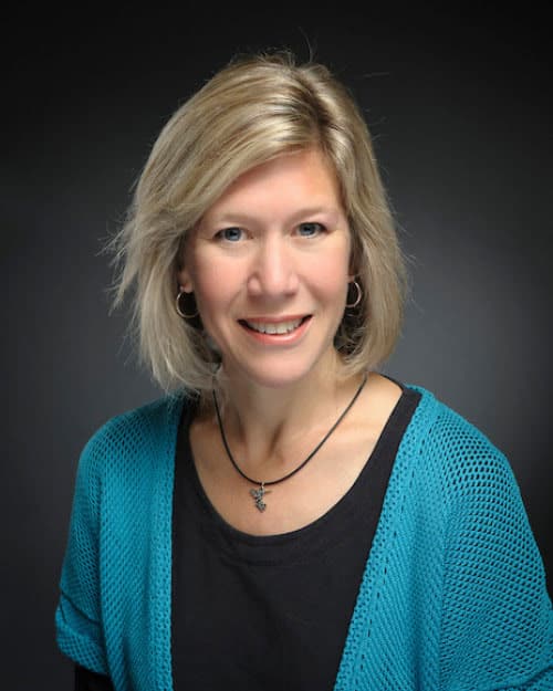 Blonde woman wearing a blue blouse